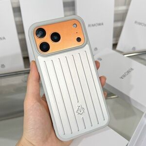 Rimowa Silver and Orange Phone Case